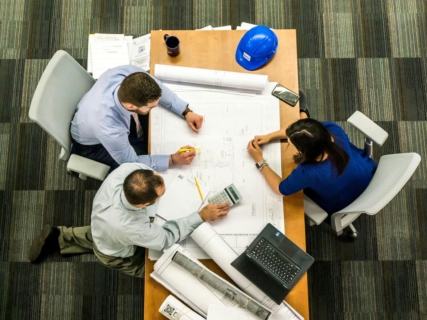 A team of engineers working at a table.