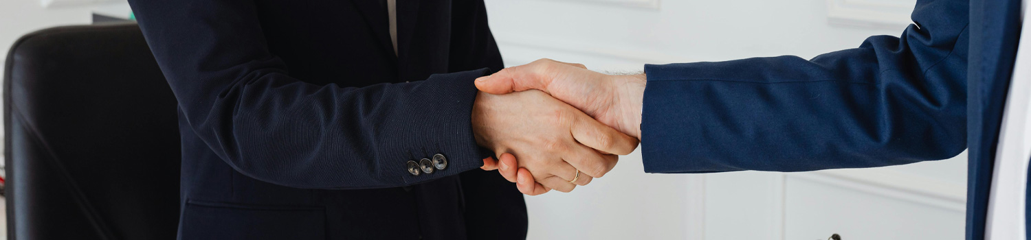 An image of two people shaking hands.