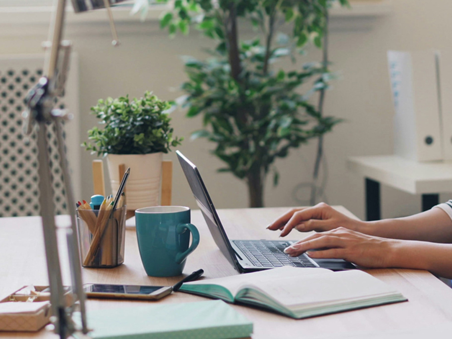 An image of a person working on a laptop.