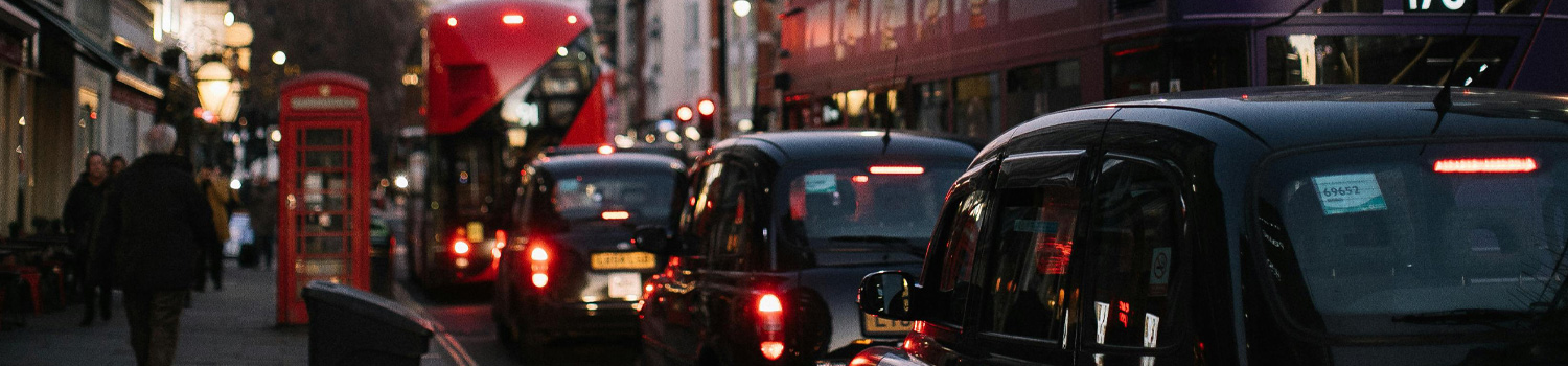 An image of vehicles waiting in traffic.